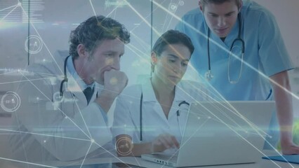 Canvas Print - Animation of network and data processing over caucasian male and female doctors using laptop