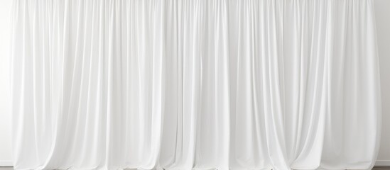 Wall Mural - A temporary white curtain hangs in front of a window, gently swaying in the breeze. The soft fabric partially obscures the view outside, adding a touch of privacy to the room.