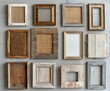 © photolas - A collection of empty picture frames with varying textures and materials is carefully arranged in an overhead flat lay setup.