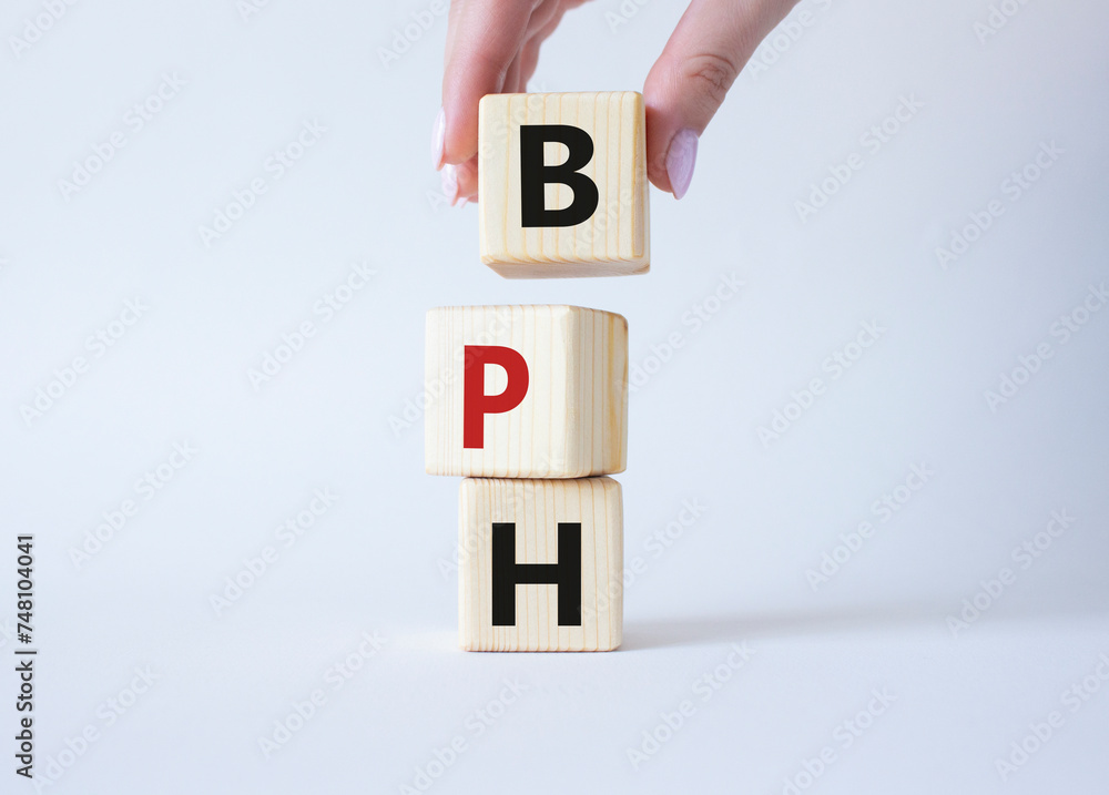 BPH - Benign Prostatic Hyperplasia symbol. Wooden cubes with word BPH ...