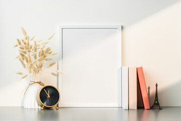 Wall Mural - Blank picture frame and dried flower in a vase on white background