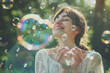 © Kien - Happy young woman and soap bubble in heart shaped