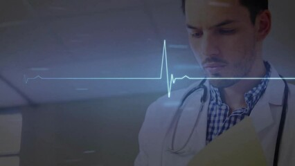 Wall Mural - Animation of diagrams and cardiograph over caucasian male doctor writing