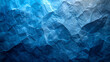 A close-up of blue, textured, abstract surface resembling crumpled paper or a rocky terrain