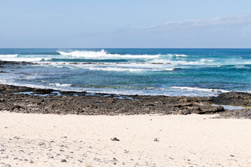 Wall Mural - Waves crashing against the rocks at El Cotillo, Fuerteventura, Canary Islands