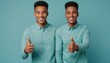 Two identical young men giving thumbs up, blue background. Their twin appearance and coordinated gestures suggest unity and agreement.