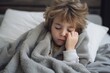 © Nico - American boy is sleeping using a gray blanket