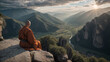 A monk dressed in orange robes meditates on a stone peak overlooking picturesque mountains, green valleys and a river, illuminated by the rays of the setting sun