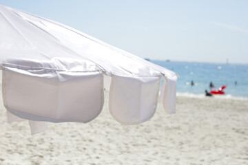 Wall Mural - White beach umbrella on the beach  