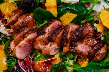 Canvas Print - Fried duck breast in honey soy glaze with mixed salad and oranges.top veiw.