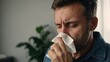 Man, blowing nose and sneezing for allergies, sick with influenza and tissue , Hayfever, sinus or virus with toilet paper for cold, flu and mucus with burnout