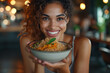 © ADDICTIVE STOCK - Radiant woman offering a bowl of healthy rice meal. Generative AI image