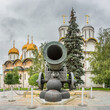 The Tsar Cannon in Moscow Kremlin against Dormition Cathedral and Church of the twelve Apostles in summer, a russian orthodox cathedrals.