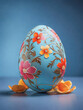 Easter egg with floral design on blue background