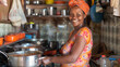 © Valentin - African woman cooking in the kitchen