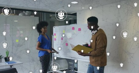 Wall Mural - Animation of robot icons over diverse colleagues discussing work