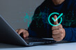 © THAWEERAT - Businessman touching a checked icon on virtual screen. Service guarantee, validation concept for business process automation, quality assurance management, iso, certification, digital transformation.