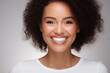 A photo portrait of a beautiful black woman over 30 years old, smiling with clean teeth, perfect teeth. To advertise dentistry. Highlighted on a white background
