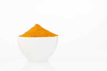 Sticker - Organic turmeric powder in the bowl - Curcuma longa