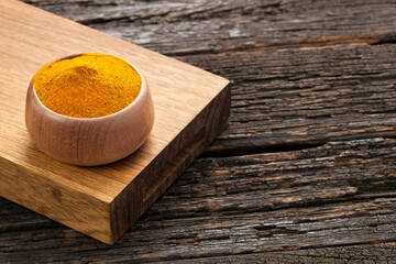 Sticker - Organic turmeric powder in the bowl - Curcuma longa