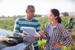 © JackF - Delivery courier invites the farmer to sign documents on the farmer field