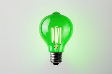 Fototapete - green neon light bulb on white wall.