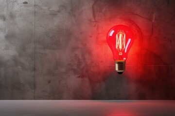 Fototapete - red neon light bulb on cement wall.