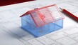 A blue transparent 3D model of a simple house with a red roof over architectural blueprint plans with a pen and pencil on the side