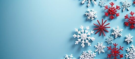 Poster - Beautiful snowflakes falling on a serene blue background in winter season