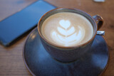 Fototapeta Mapy - Coffee cup on wood table 