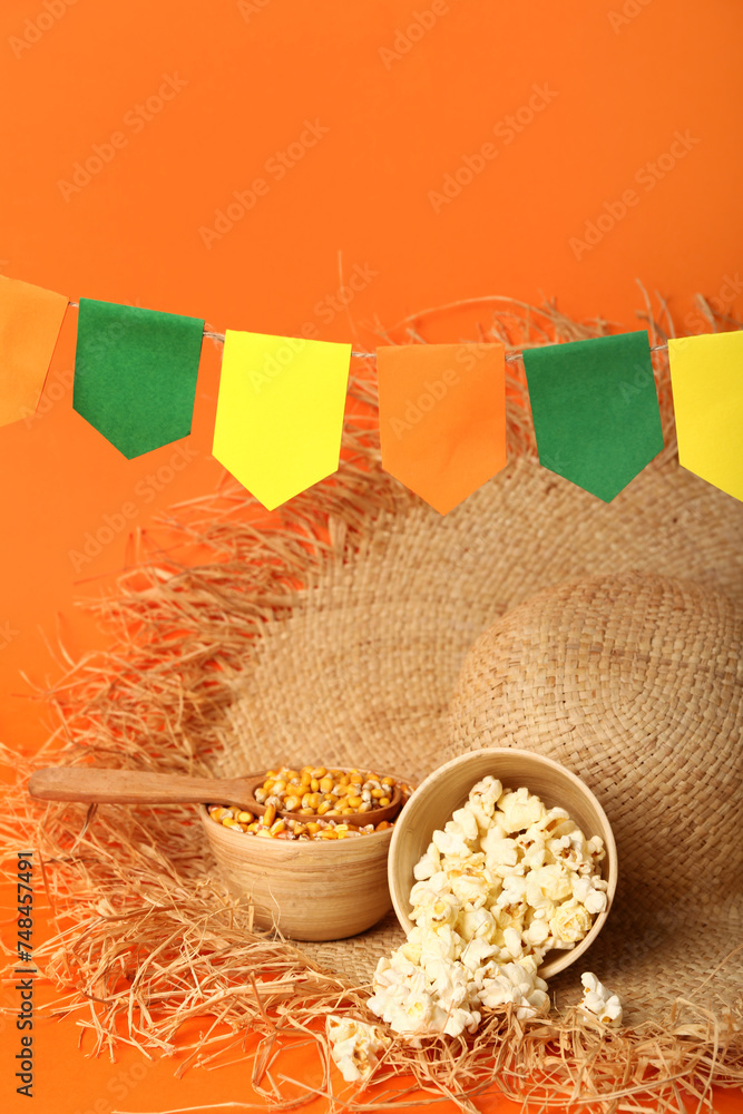 Bowls of corn with straw hat and flags on red background. Festa Junina (June Festival) celebration