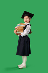 Sticker - Little girl in graduation hat with books on green background. End of school year