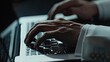 Pan closeup shot of hands of unrecognizable businessman typing on laptop while working in the office