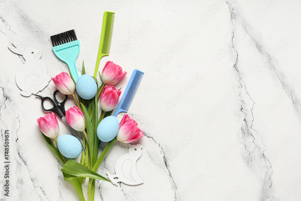 Composition with hairdresser's tools, tulip flowers and Easter eggs on light background