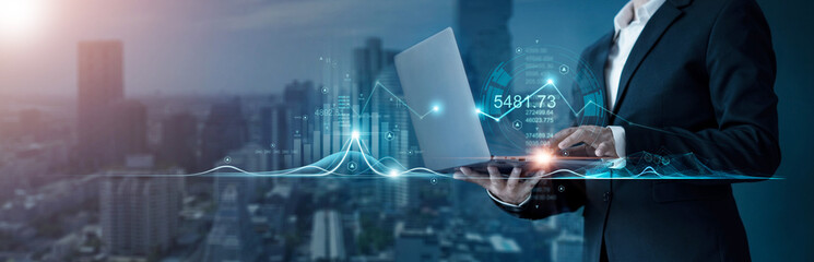 Leinwandbilder - Businessman analyzing business marketing research and economic growth graph to develop smart solution in business strategy planning. Business tools intelligence technology for success decision making.