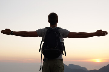 Canvas Print - Man, silhouette and freedom with mountain, sunset and adventure for travel or holiday. Tourist, brazil and backpack with sunrise, view and nature for calm and fulfillment with hike for health