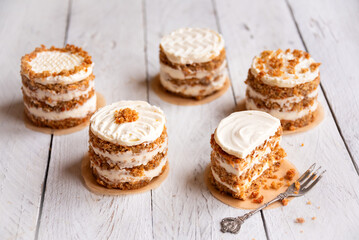 Wall Mural - Small carrot cakes on white background