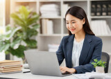 Fototapeta Przestrzenne - Asian business woman working on a laptop in office