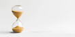 © annaspoka - hourglass business finance investing background banner on white with copy space