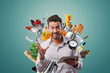 © stokkete - Happy man surrounded by kitchen utensils and connecting online