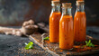 Carrot juice with flax seeds in glass bottles.