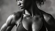 © CinimaticWorks - stunning black and white photograph featuring the torso of a very muscular young woman with copy space, highlighting strength and empowerment