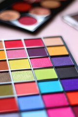 Canvas Print - Various colorful eyeshadow palettes on bright pink background. Selective focus.