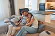 © standret - On the sofa. Parents with two little boys kids are together in domestic room