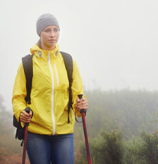 Canvas Print - Woman, trekking and fitness in nature with pole for backpacking, travel and outdoor adventure. Journey, path and female person in hiking gear for exercise, balance or health in forest trail.