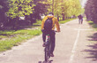 © licvin - Cyclist ride on the bike path in the city Park