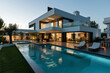 Contemporary Home with Pool and Outdoor Living Space at Dusk