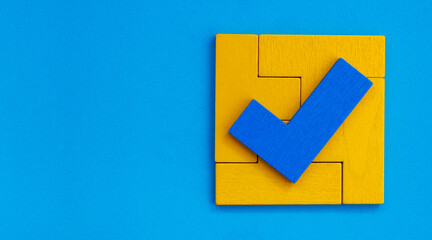 check mark on puzzle pieces that form a box