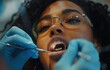 © Viktoriia - Close up woman undergoing a dental procedure