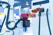 © xiaoliangge - smart robot in manufacturing industry for industry 4.0 and technology concept. Robotic vision sensor camera system for electric vehicles battery charge service